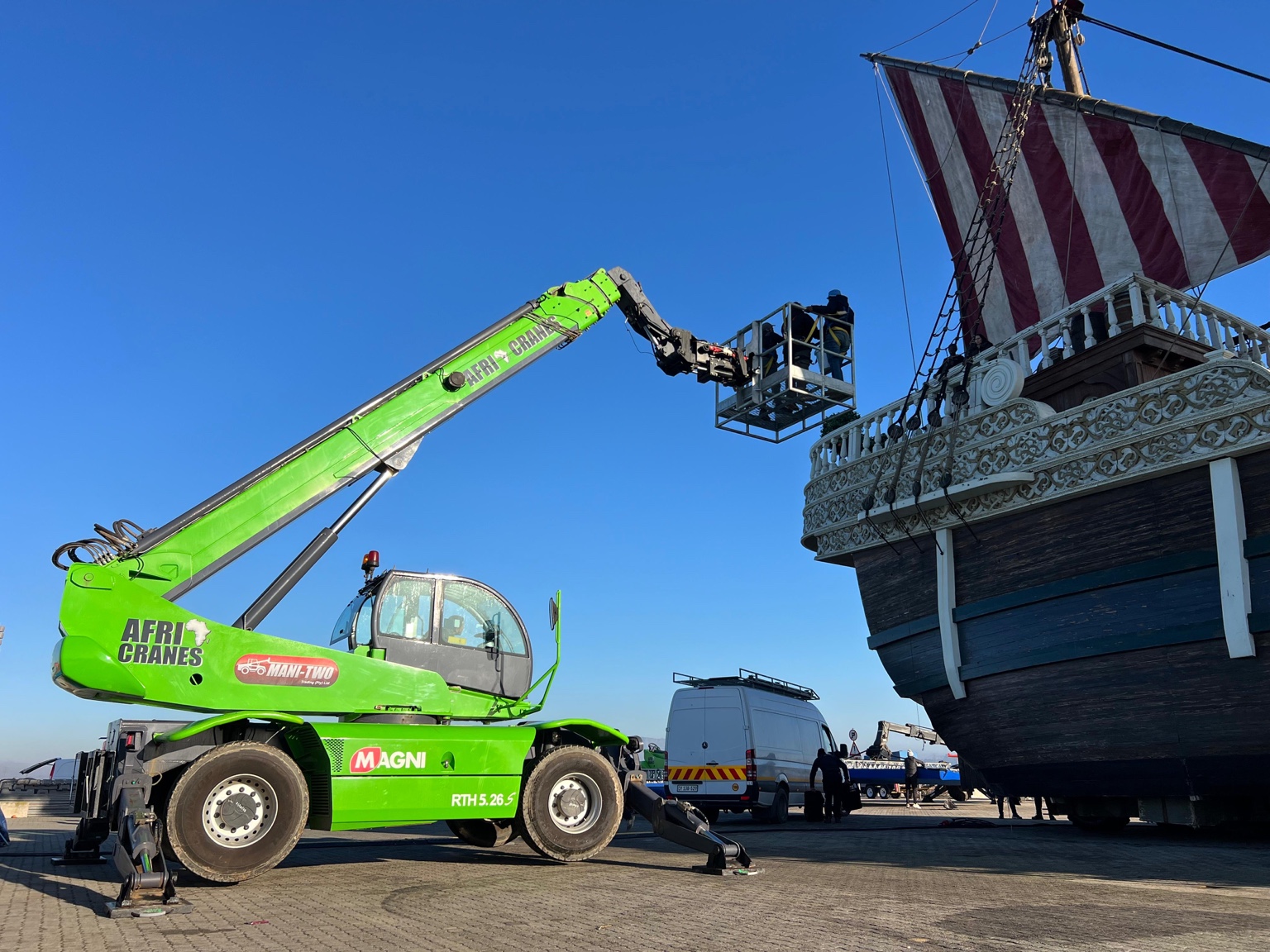 Afri Cranes lifting equipment beside a ship